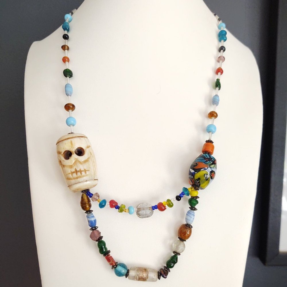 Unique carved stone face statement glass beaded necklace